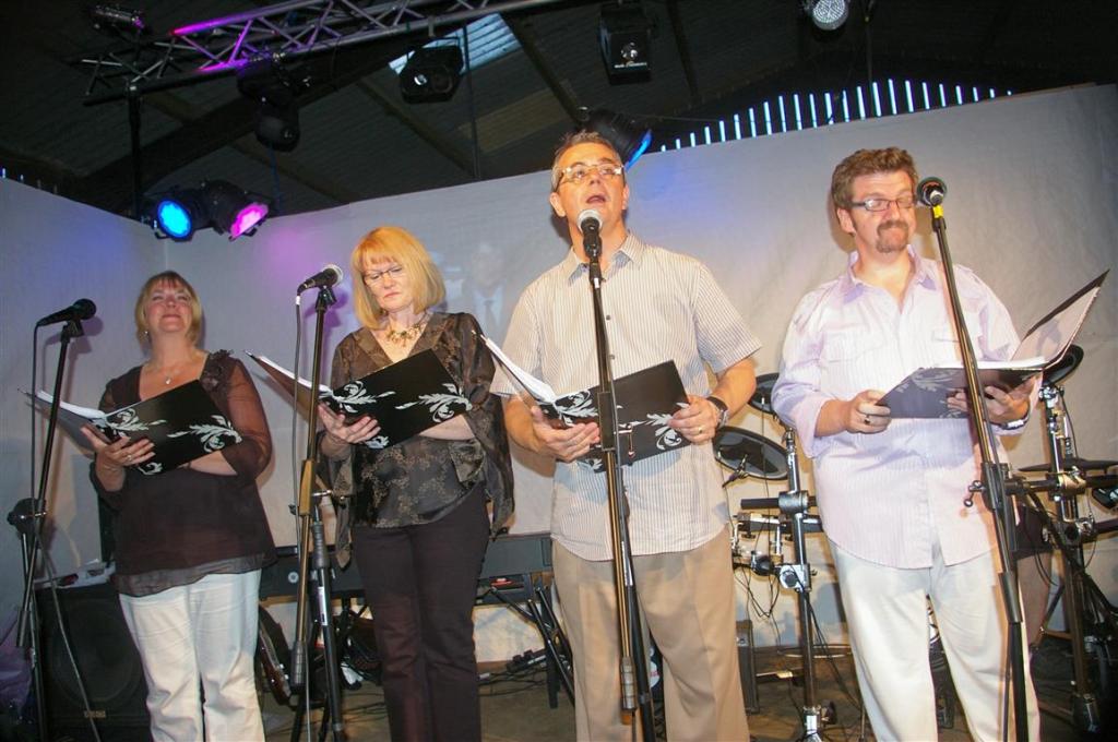 Brother Chris sings with his wife Sue and friends